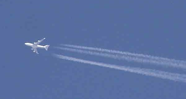 Aircraft in cruise at roughly 35,000 feet above Bristol, England. Photographed by Adrian Pingstone in October 2005 and released to the public domain.